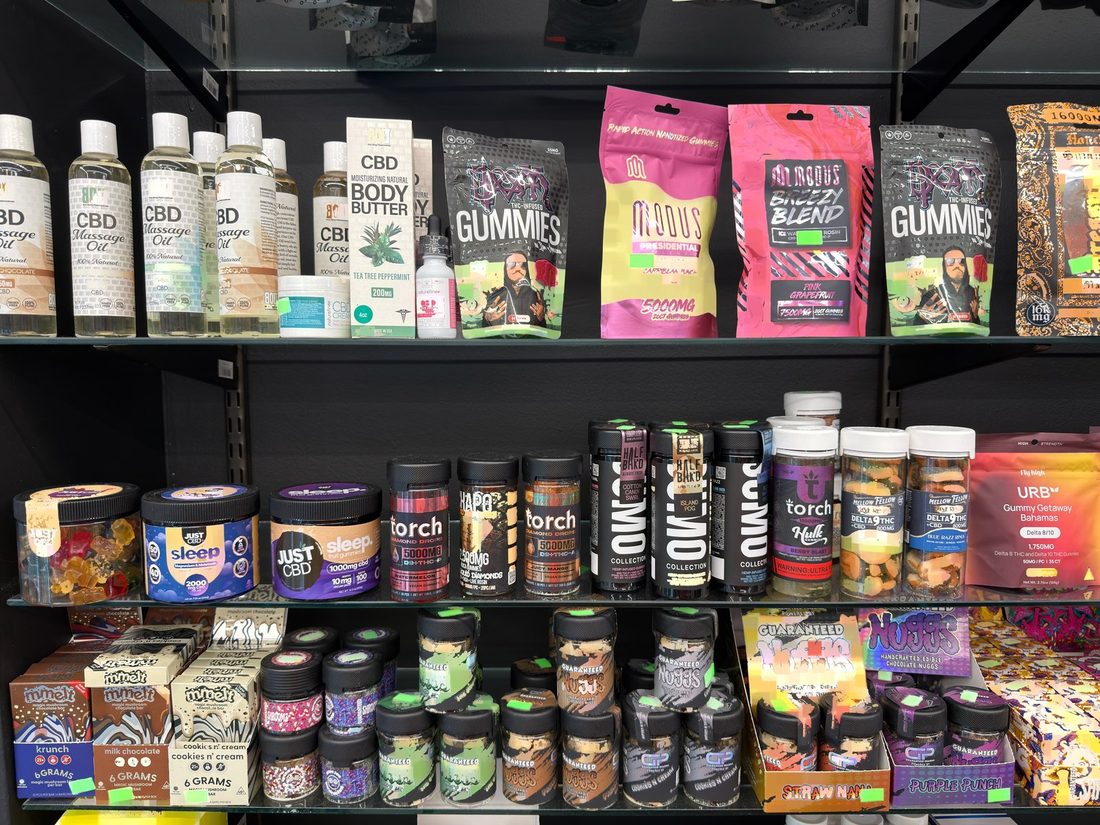 The upper shelves of the 21+ case behind the counter