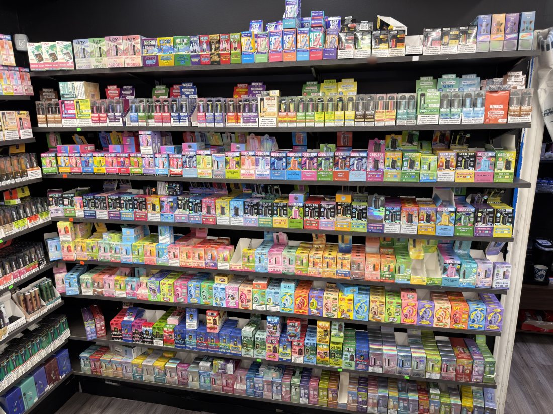 The floor-to-ceiling disposable vape wall at Glen Smoke Shop