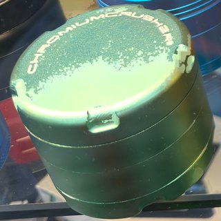 Chromium Crusher Teal Iridescent 4-Piece Grinder on the shelf at Glen Smoke Shop
