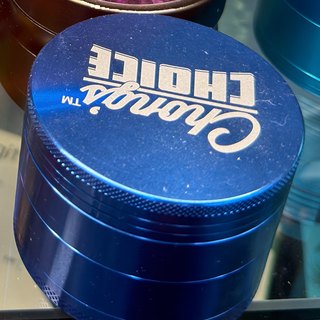 Chronic's Choice Cobalt Blue 4-Piece Grinder on the shelf at Glen Smoke Shop
