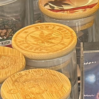 Glass Jar with Stamped Bamboo Lid on the shelf at Glen Smoke Shop