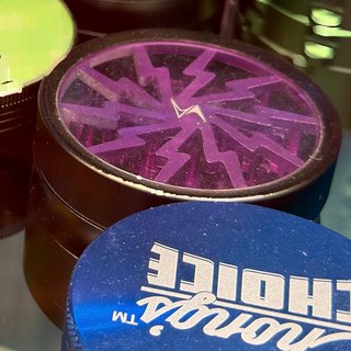Black 3-Piece Grinder with Clear Window Lid on the shelf at Glen Smoke Shop