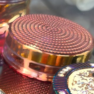 Rose Gold Spiked-Crown 4-Piece Grinder on the shelf at Glen Smoke Shop