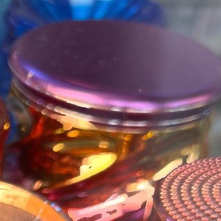 Violet Mirror-Lid Rainbow 4-Piece Grinder on the shelf at Glen Smoke Shop