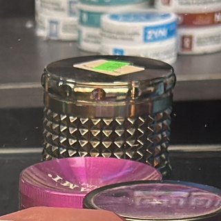 Chrome Spiked-Body Grinder on the shelf at Glen Smoke Shop