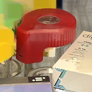 Glass Jar with Red Silicone Cap on the shelf at Glen Smoke Shop