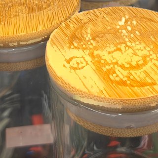 Glass Jar with Engraved Bamboo Lid on the shelf at Glen Smoke Shop