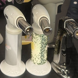 Green Mottled Novelty-Shape Torch Lighter on the shelf at Glen Smoke Shop