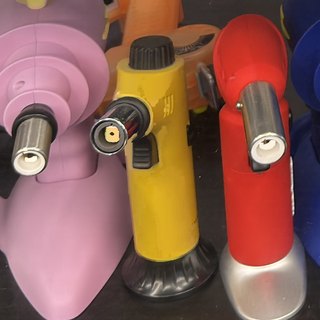 Yellow Silicone Torch Lighter with Flame Dial on the shelf at Glen Smoke Shop