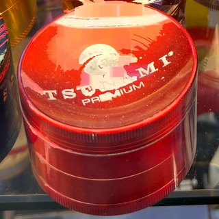 Tsunami Premium Red 4-Piece Grinder on the shelf at Glen Smoke Shop