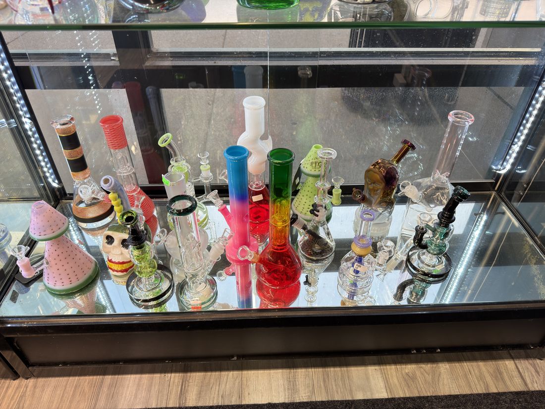 Recyclers and dab rigs on a mirrored glass shelf