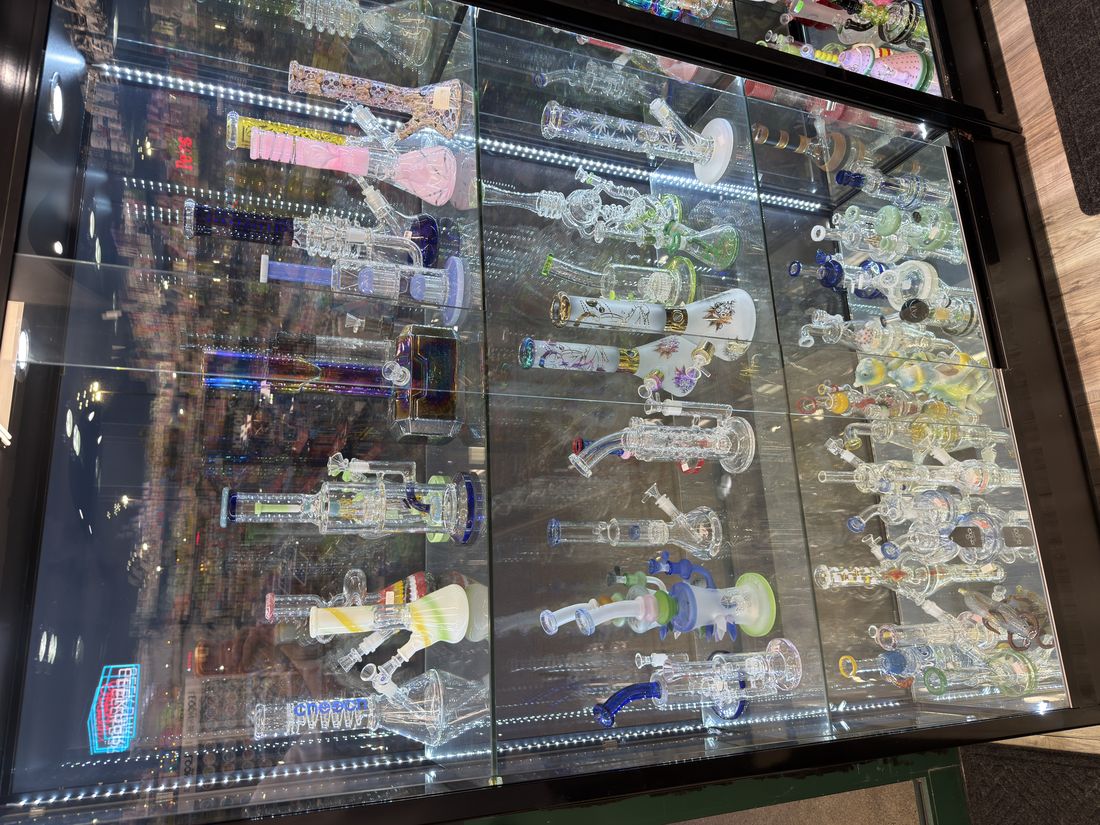Hand-blown glass pipes lit from below in the front case
