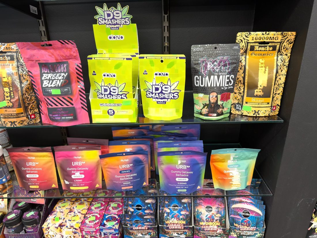 Hemp-derived gummies and CBD topicals on a shelf behind the counter