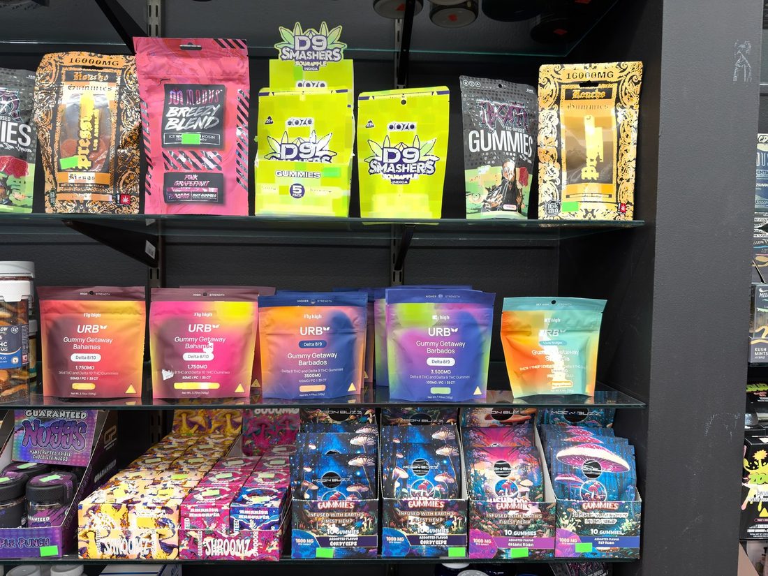 The middle shelf of the 21+ case behind the counter