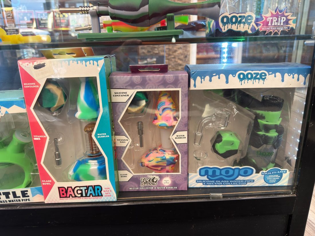 Boxed silicone nectar collector and bubbler kits side by side in the case