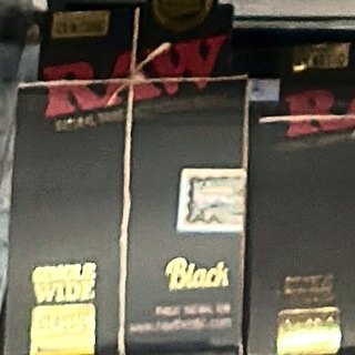 RAW Black Single Wide Rolling Papers on the shelf at Glen Smoke Shop