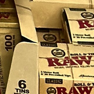 RAW Pre-Rolled Tips Tin (100 tips) on the shelf at Glen Smoke Shop