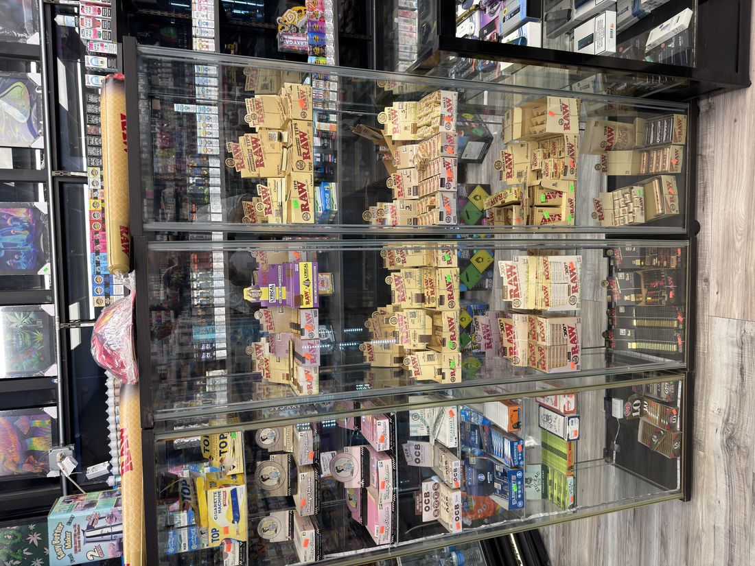 A wall of RAW rolling papers, cones and wraps at Glen Smoke Shop