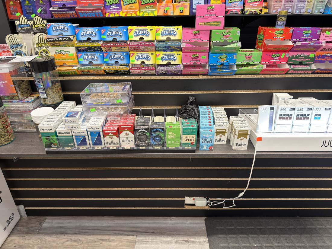 Nicotine pouch and JUUL display along the counter run