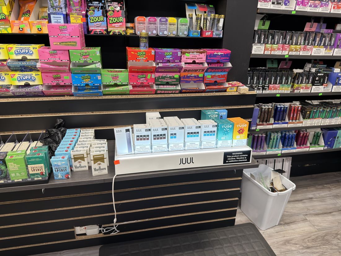 The nicotine pouch wall beside the counter
