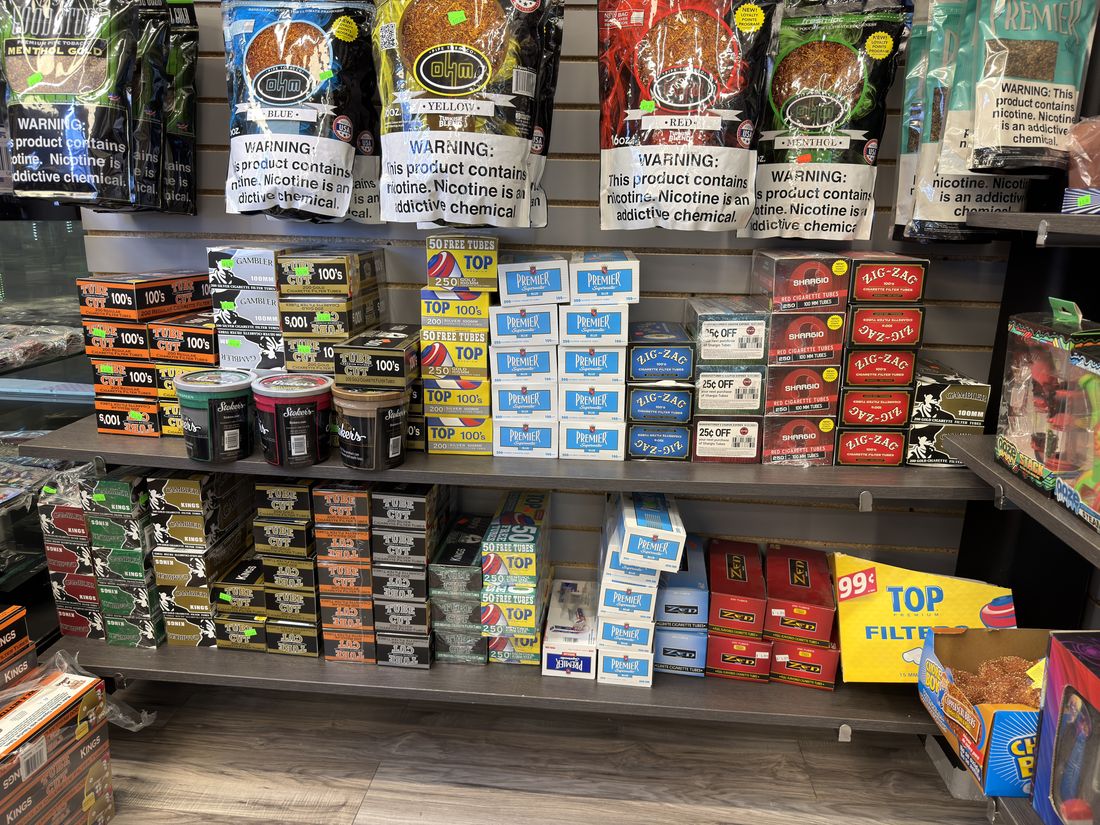 Rolling tobacco pouches, cigarette tubes and TOP filters on the shelf