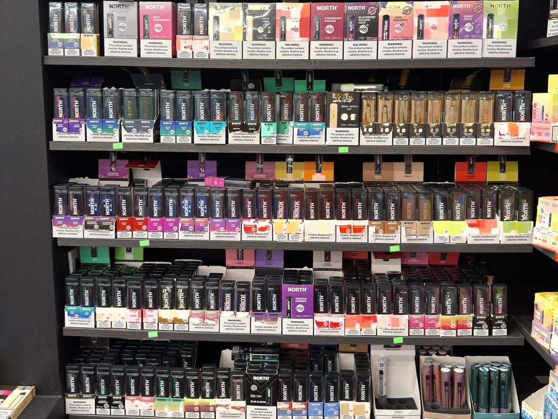 The full disposable vape wall at Glen Smoke Shop, stocked front to back