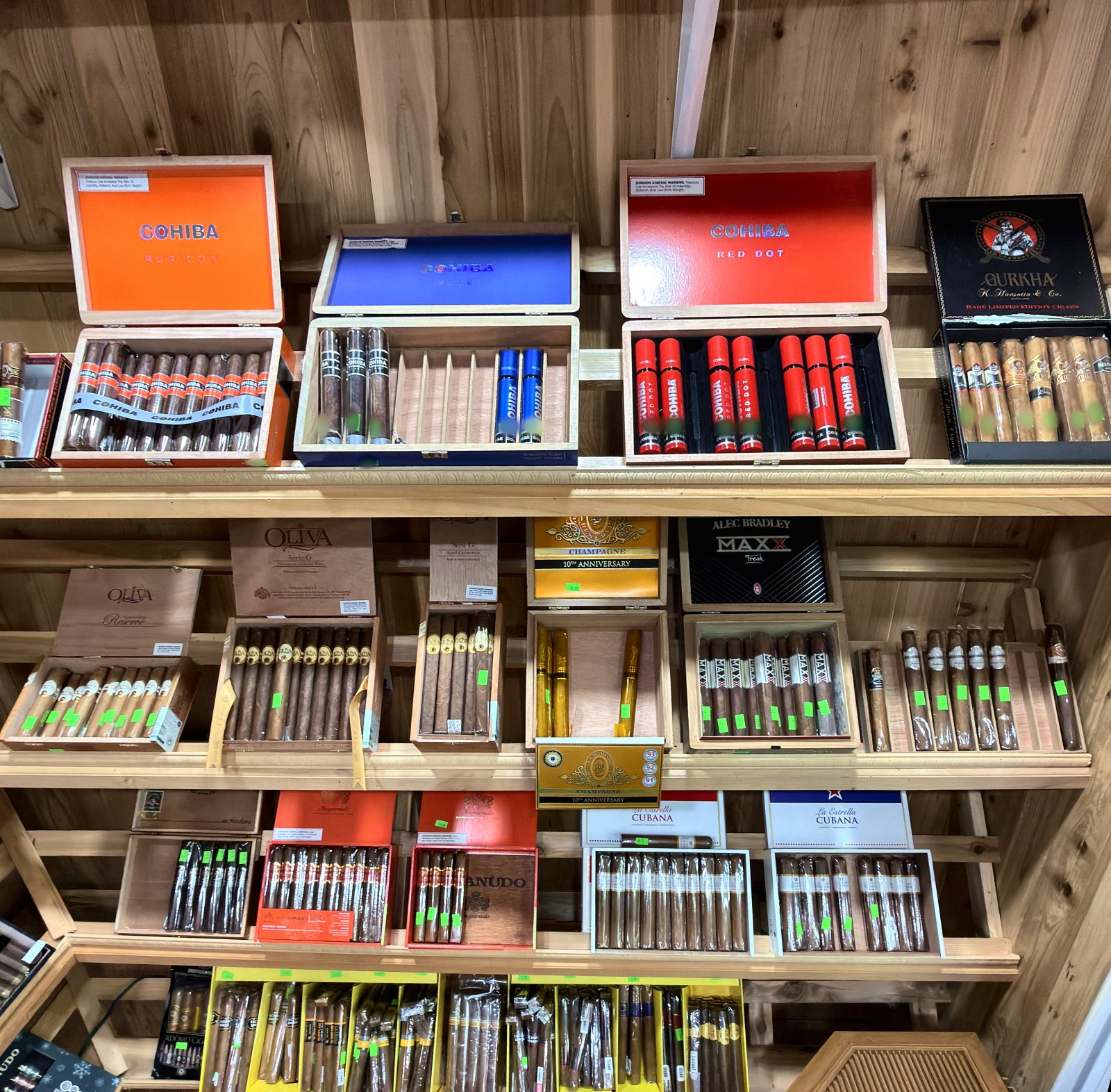 Cedar humidor shelves lined with cigars