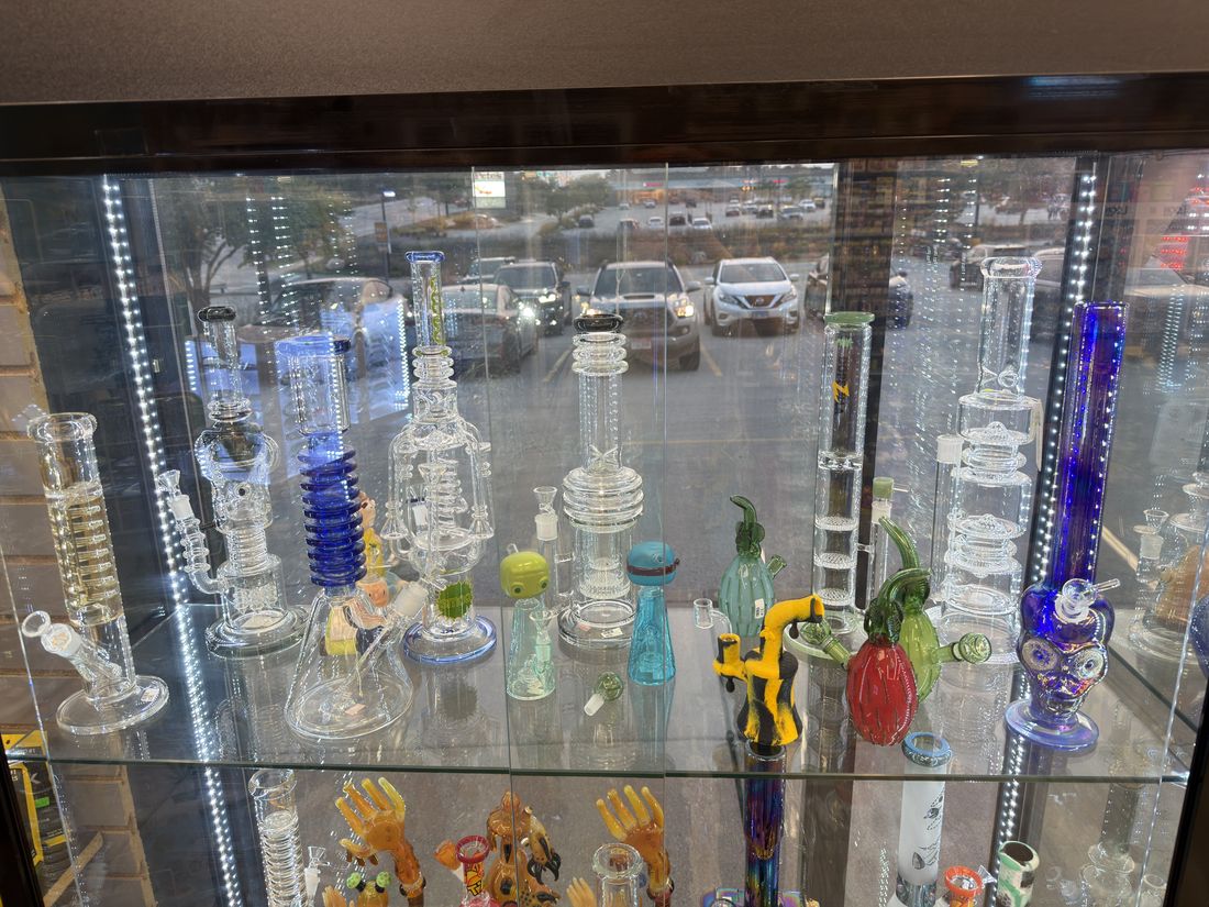 Percolator water pipes and recyclers behind glass