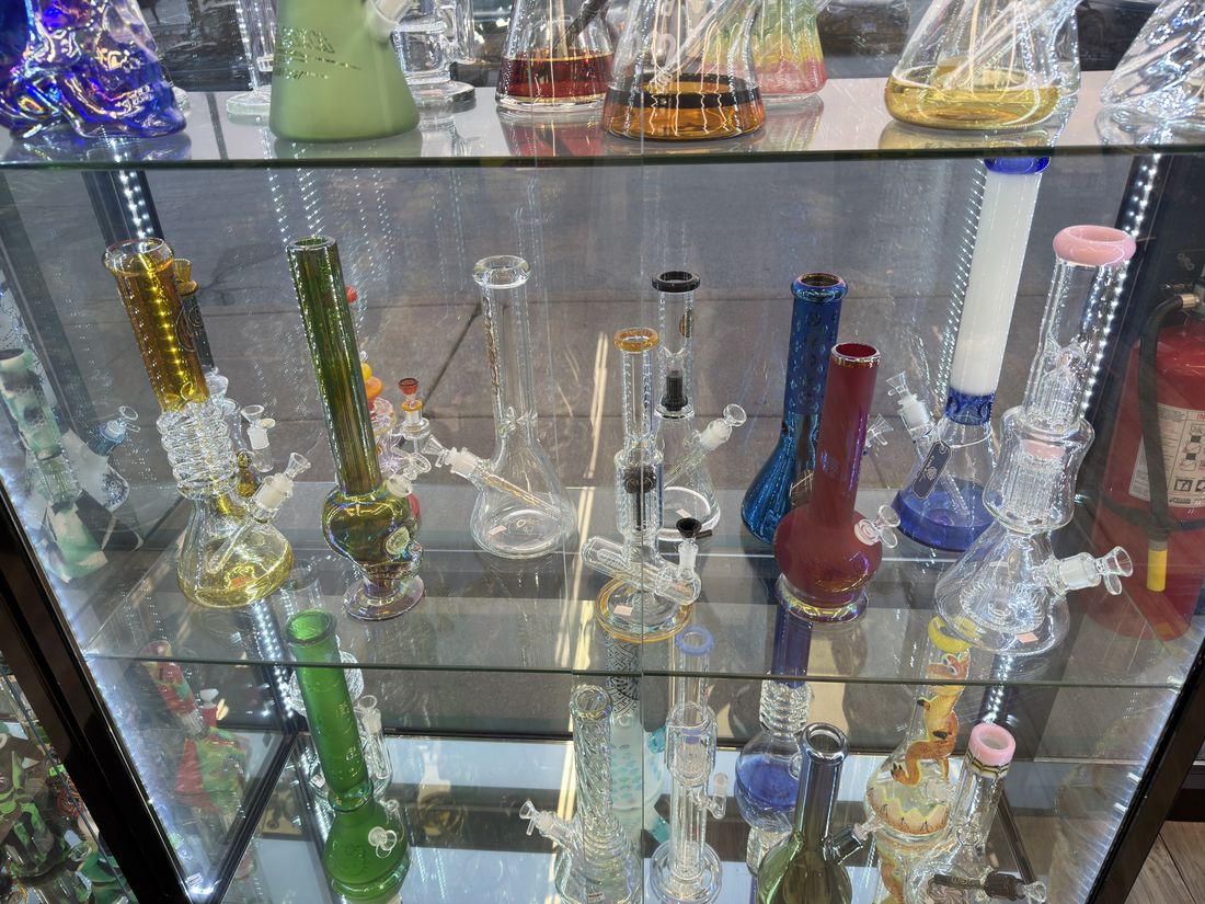 Tall water pipes and percolators filling a display bay
